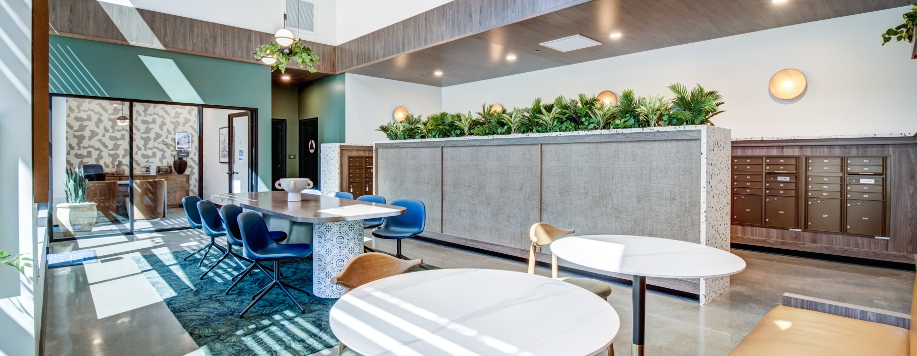 Large room with two small tables and a large boardroom style table