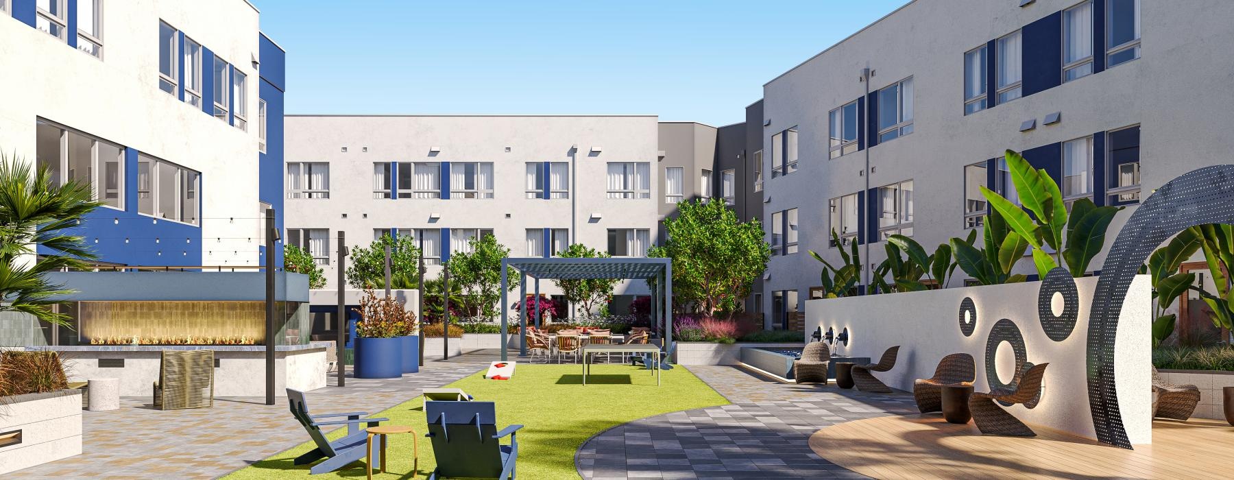 a courtyard with tables and chairs and buildings