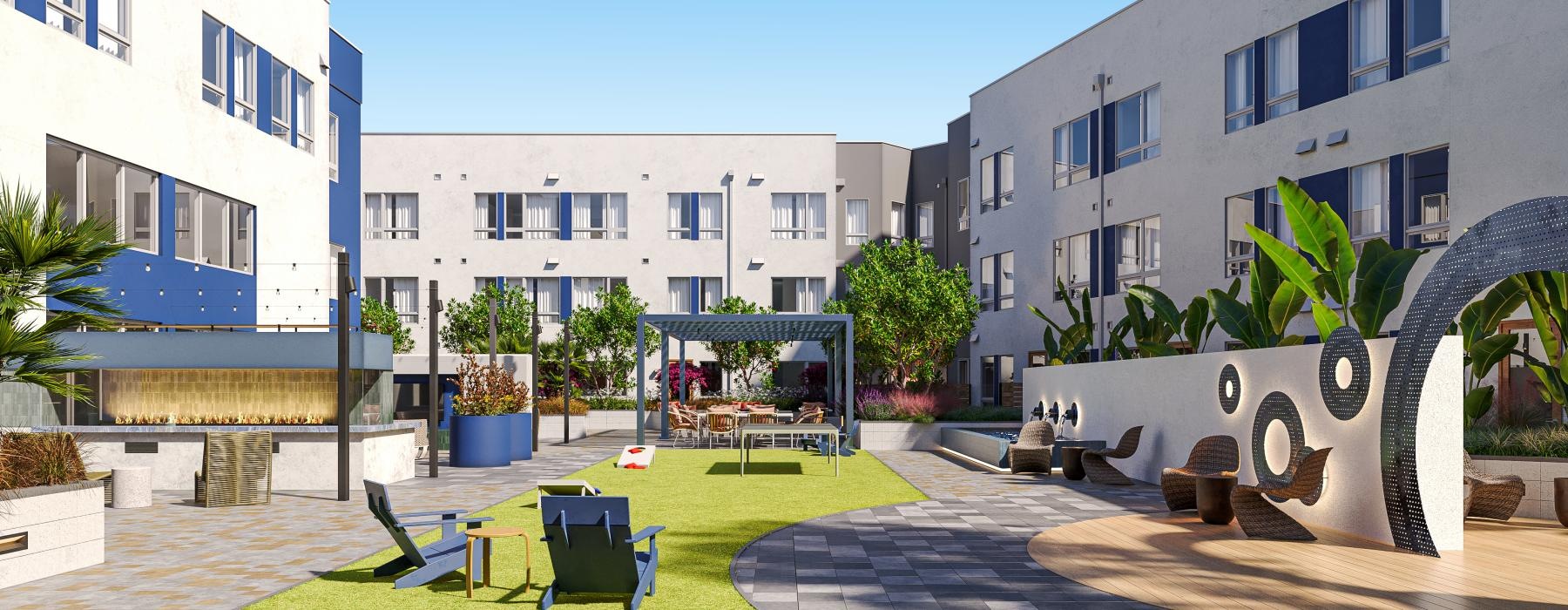 a courtyard with tables and chairs and buildings