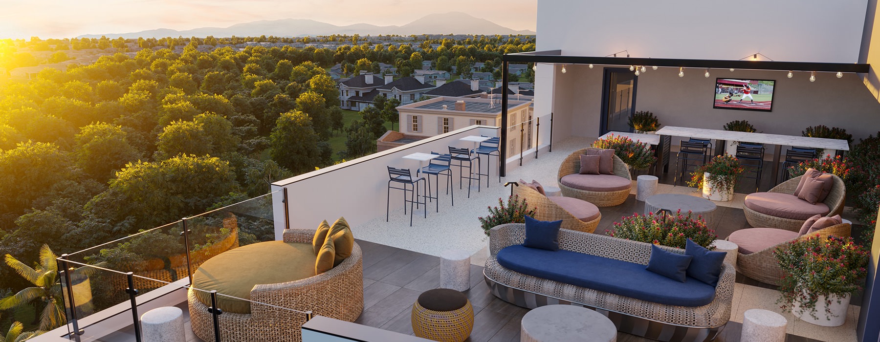 rooftop patio with seating and a view of trees